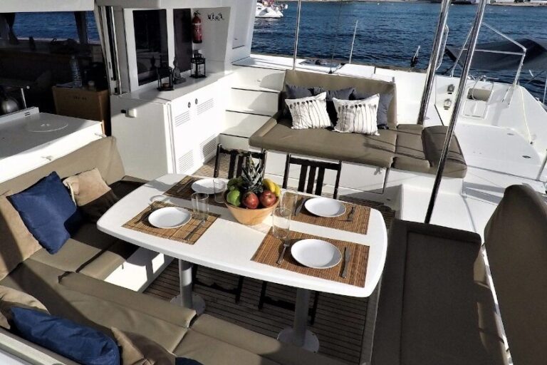 Table and sofas at the stern of the catamaran